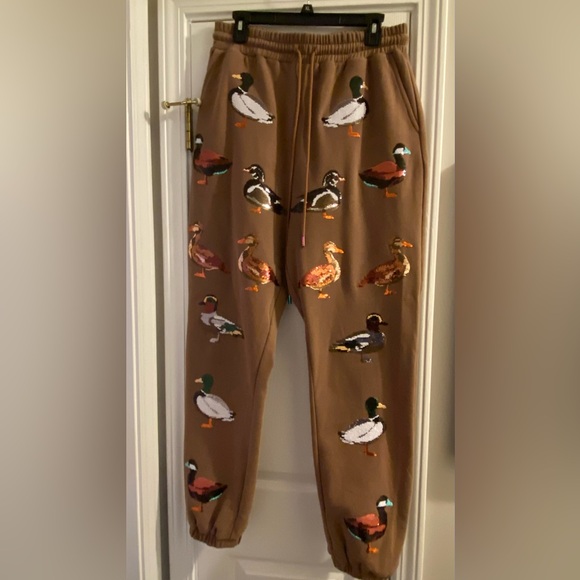 QUEEN OF SPARKLES Pants - QUEEN OF SPARKLES Brown Duck Print Joggers